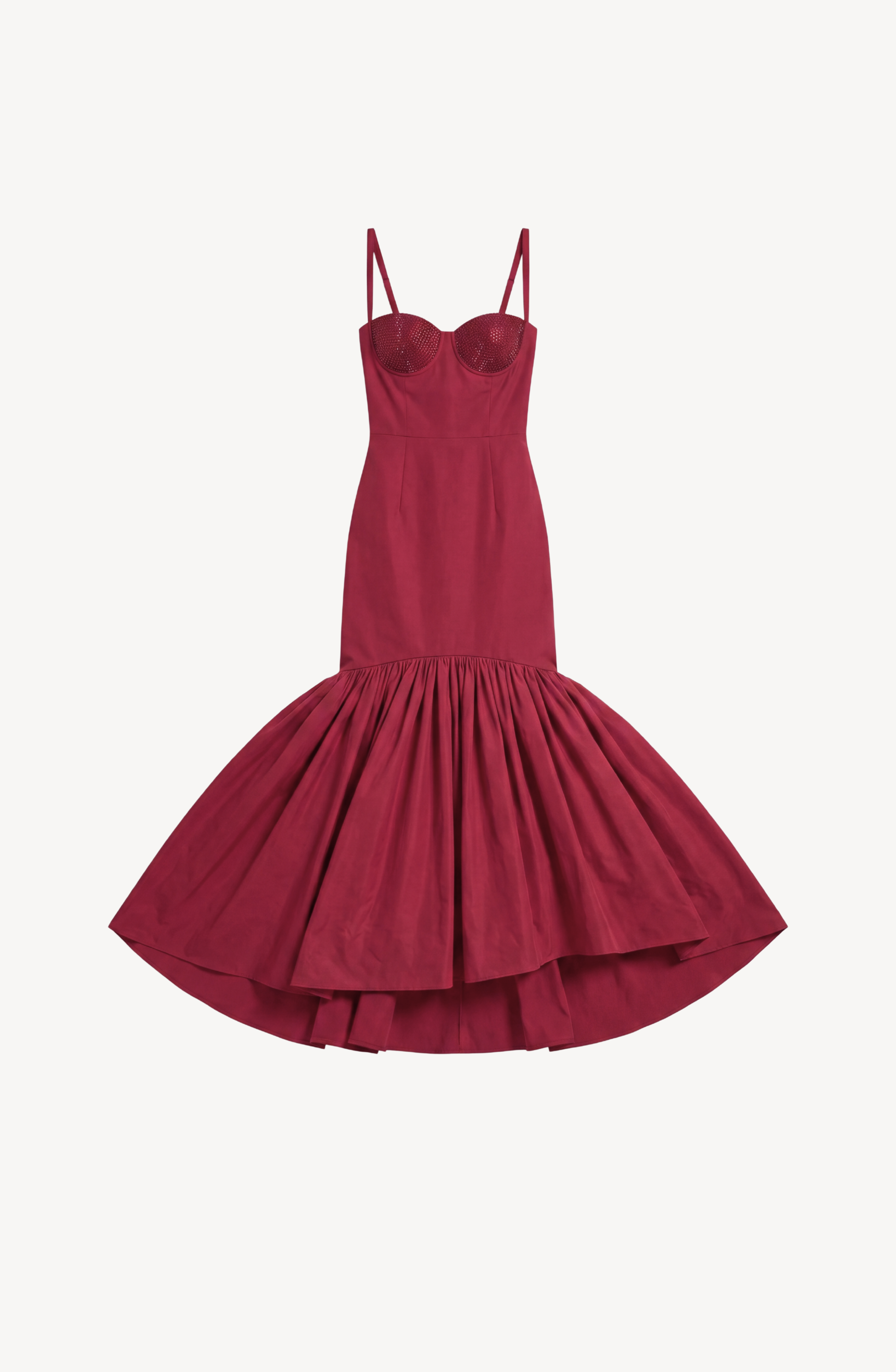 LOULOU's Crystal-Embellished Bustier Gown is a sleeveless, fitted ruby red gown with thin straps and a structured bodice, showcasing a dramatic flared skirt that begins at mid-thigh with a striking high-low hemline, presented against a white background.