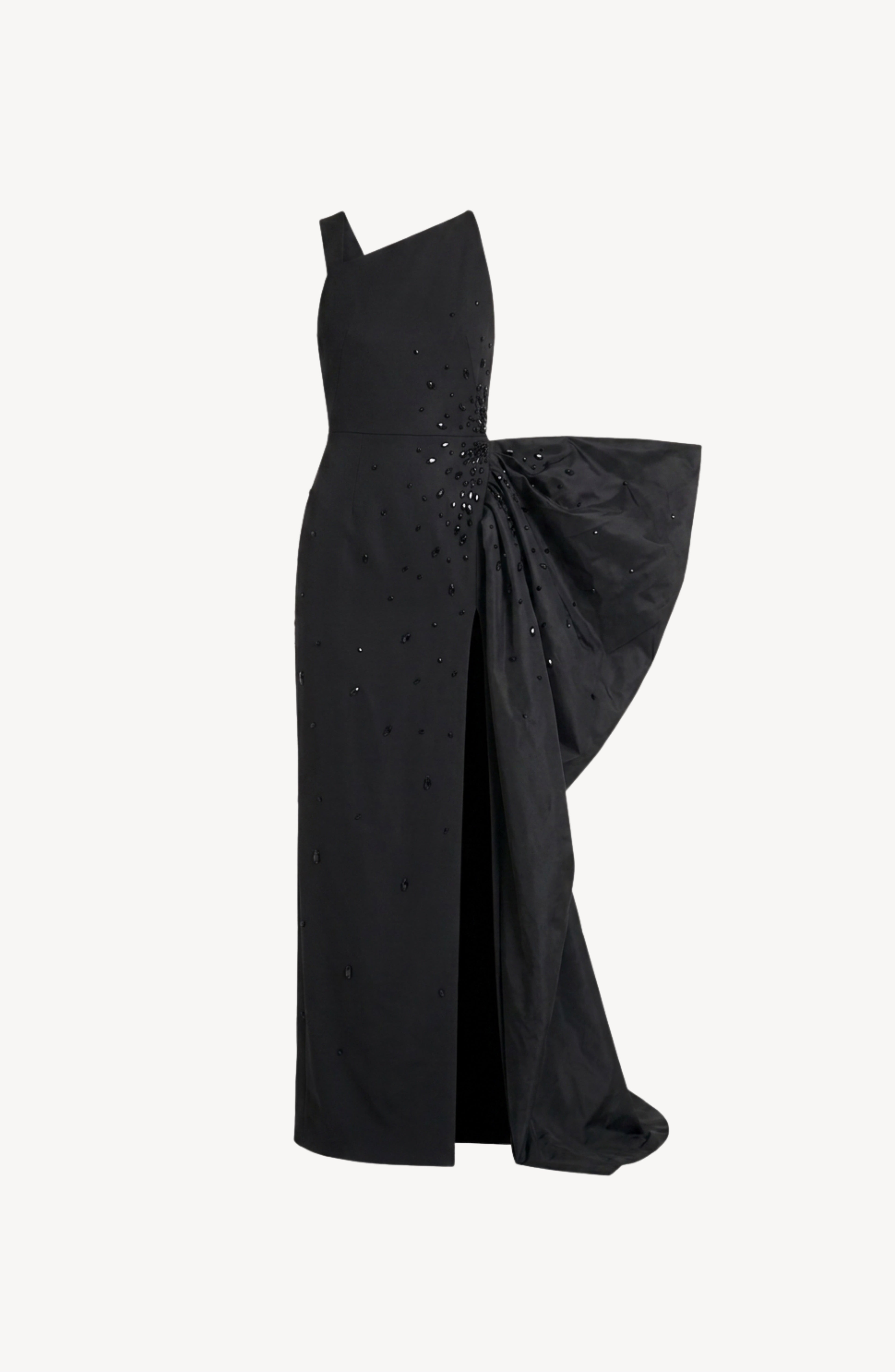 The Asymmetrical Embellished Gown by LOULOU showcases an elegant black design with an asymmetrical neckline, shimmering sequin and crystal embellishments, a thigh-high slit, and a dramatic oversized draped bow detail at the right hip.