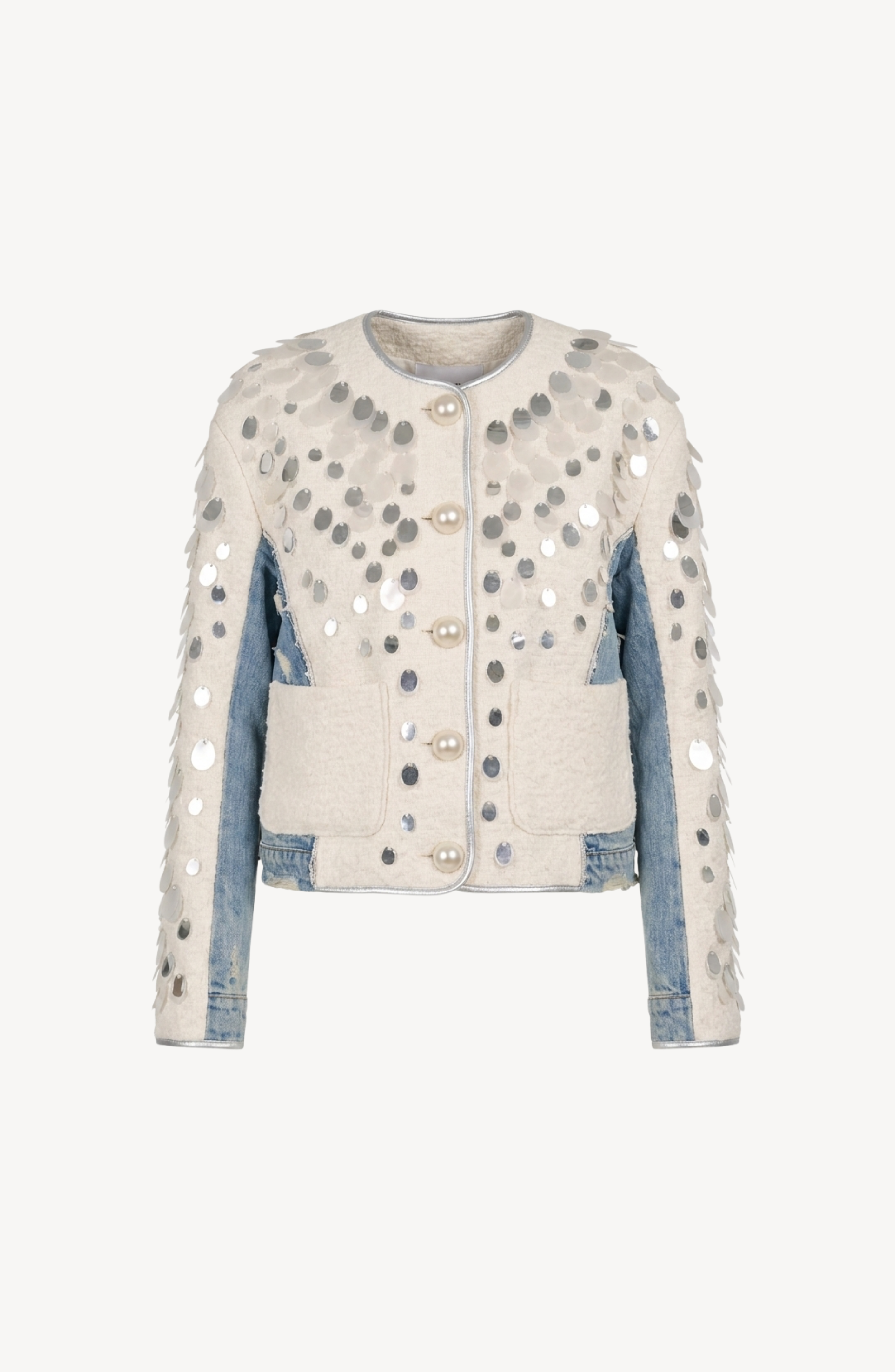 The LOULOU Embellished Panelled Cropped Jacket features a cream and denim colorway with large silver sequins adorning the front, sleeves, and shoulders. This collarless jacket is designed with a round neckline, embellished pearl buttons, ivory textured panels, and patch pockets on both sides.