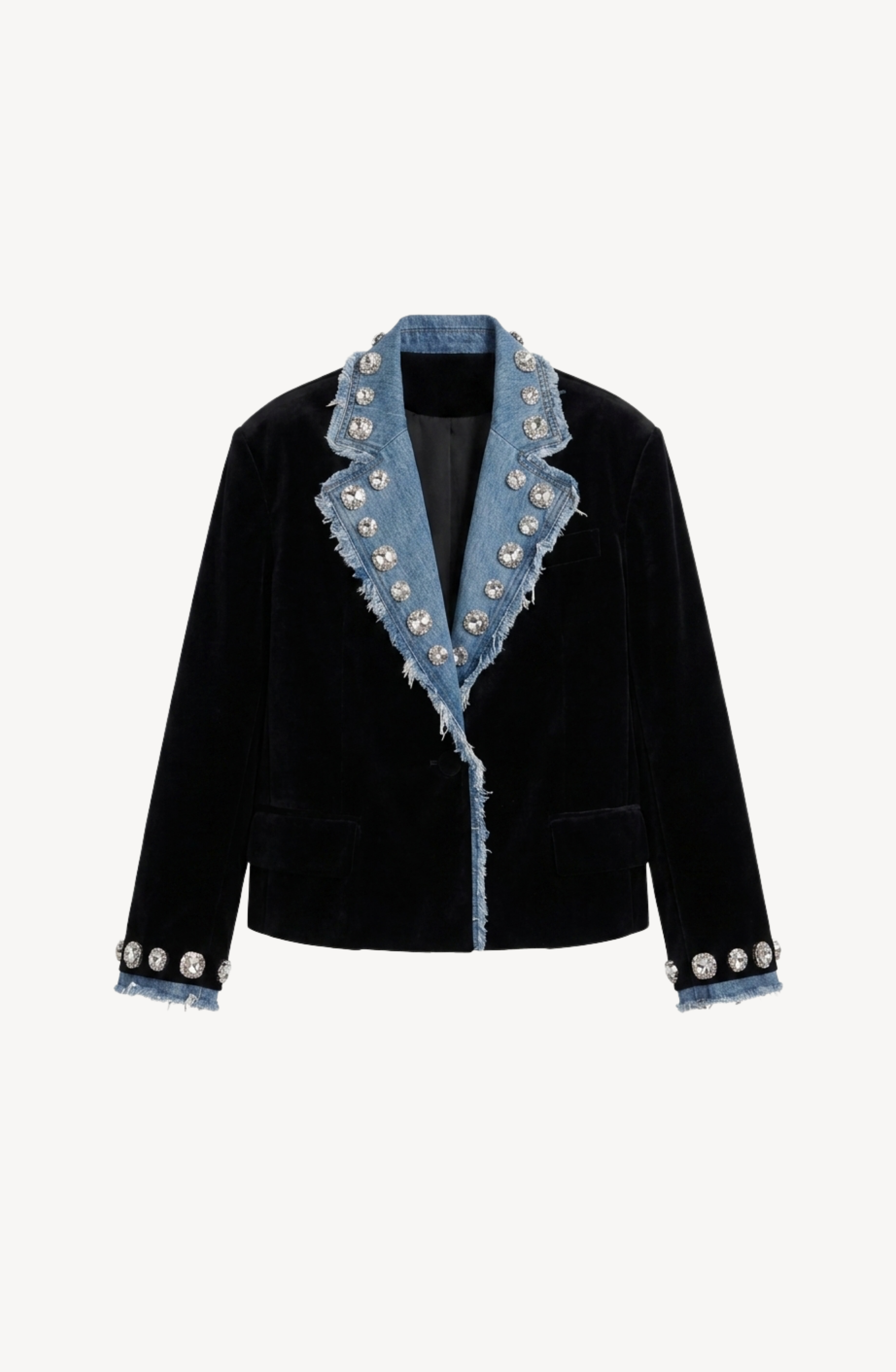 The LOULOU Velvet And Denim Crystal Blazer features a black velvet body with frayed blue denim lapels, cuffs, and trim. Large silver buttons accent the collar, lapels, and cuffs, while elegant glass crystal embellishments provide a striking touch of sparkle to this distinctive design.