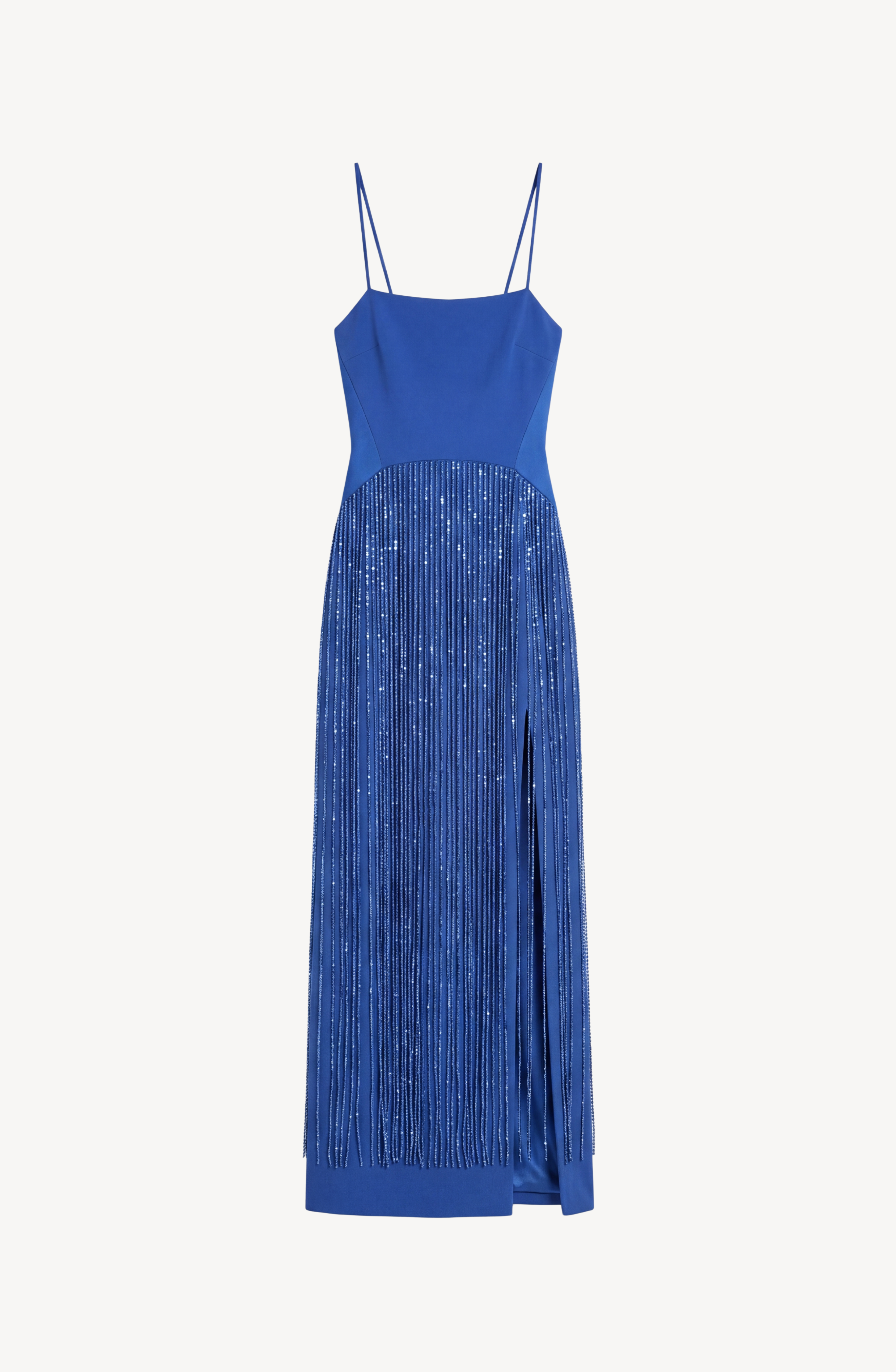 The LOULOU Cobalt Crystal Fringe Maxi Dress is a sleeveless, cobalt blue maxi dress featuring thin spaghetti straps, a fitted bodice, and a skirt adorned with crystal-fringed vertical detailing and a high side slit.