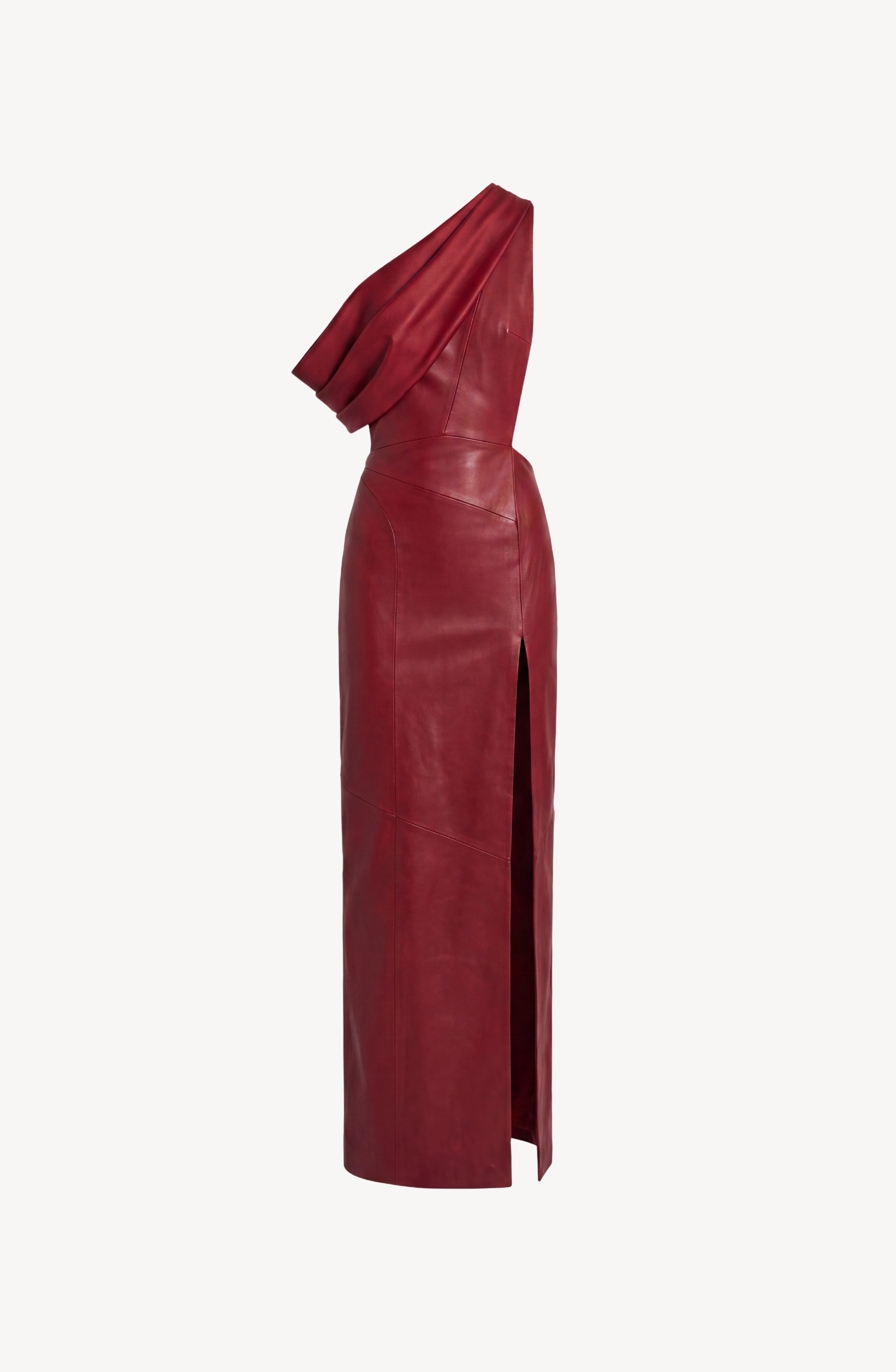 The LOULOU One-Shoulder Leather Maxi Dress in oxblood showcases a draped bodice and a dramatic high side slit, creating a striking silhouette against a white background.