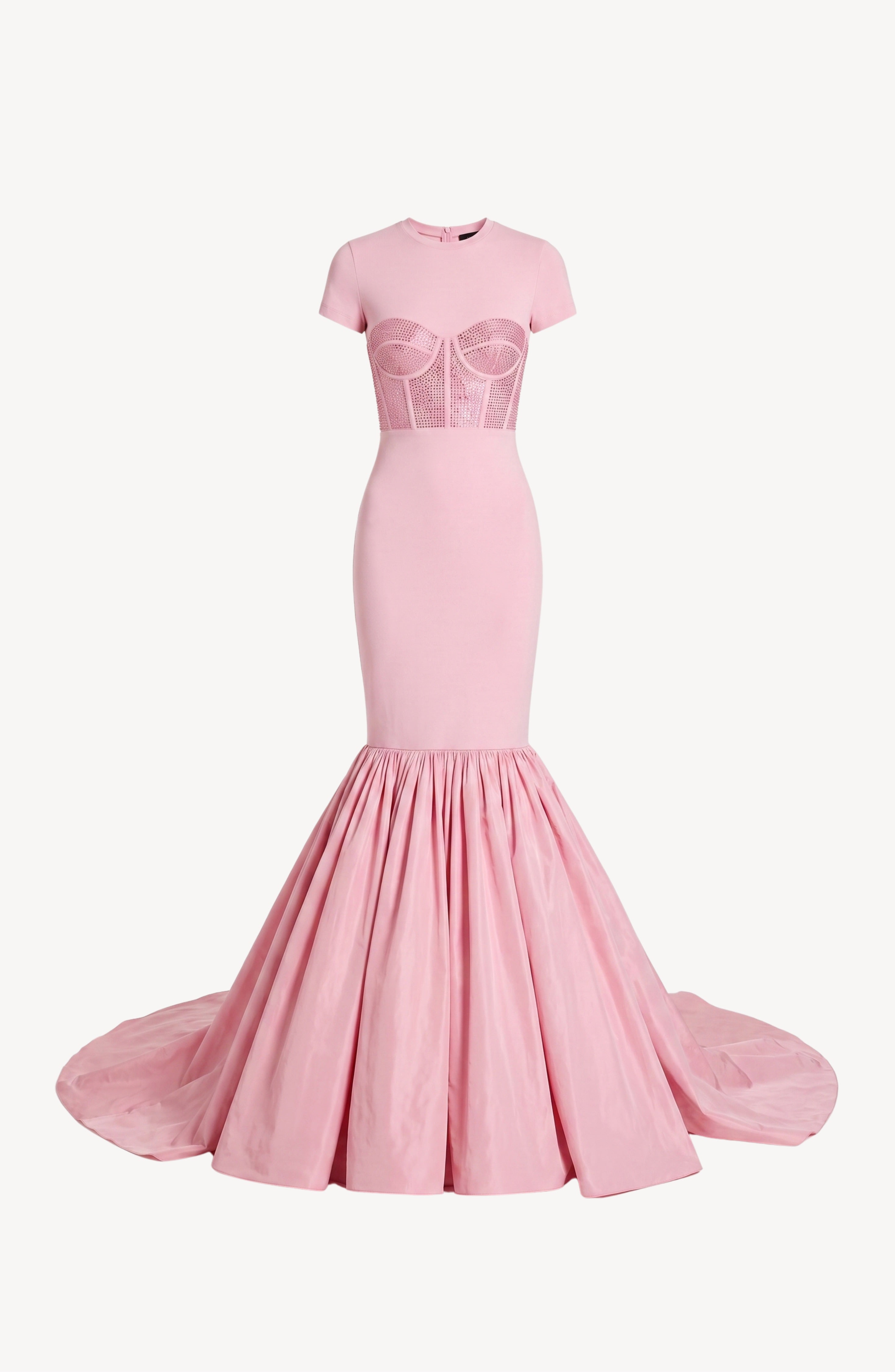 The Corset Mermaid Gown by LOULOU features a fitted silhouette in light pink, showcasing a crystal-embellished, corset-style mesh bodice with short sleeves and a dramatic taffeta mermaid skirt that flares into a small train.