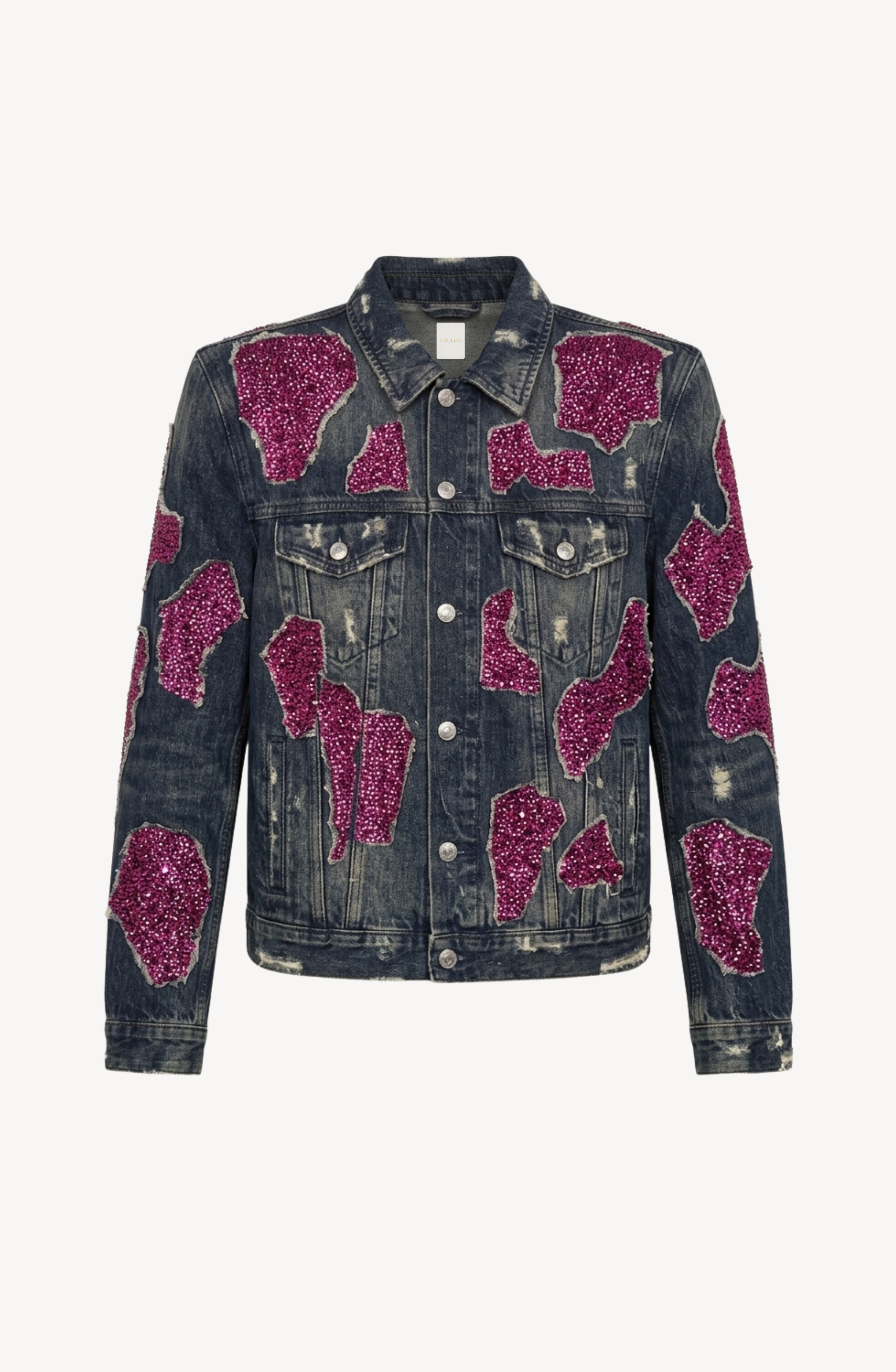 The LOULOU Embellished Denim Jacket features a distressed vintage-washed denim construction with front buttons, breast pockets, and striking magenta sequin appliqués adorning the front, sleeves, and padded shoulders. Displayed against a plain white background.