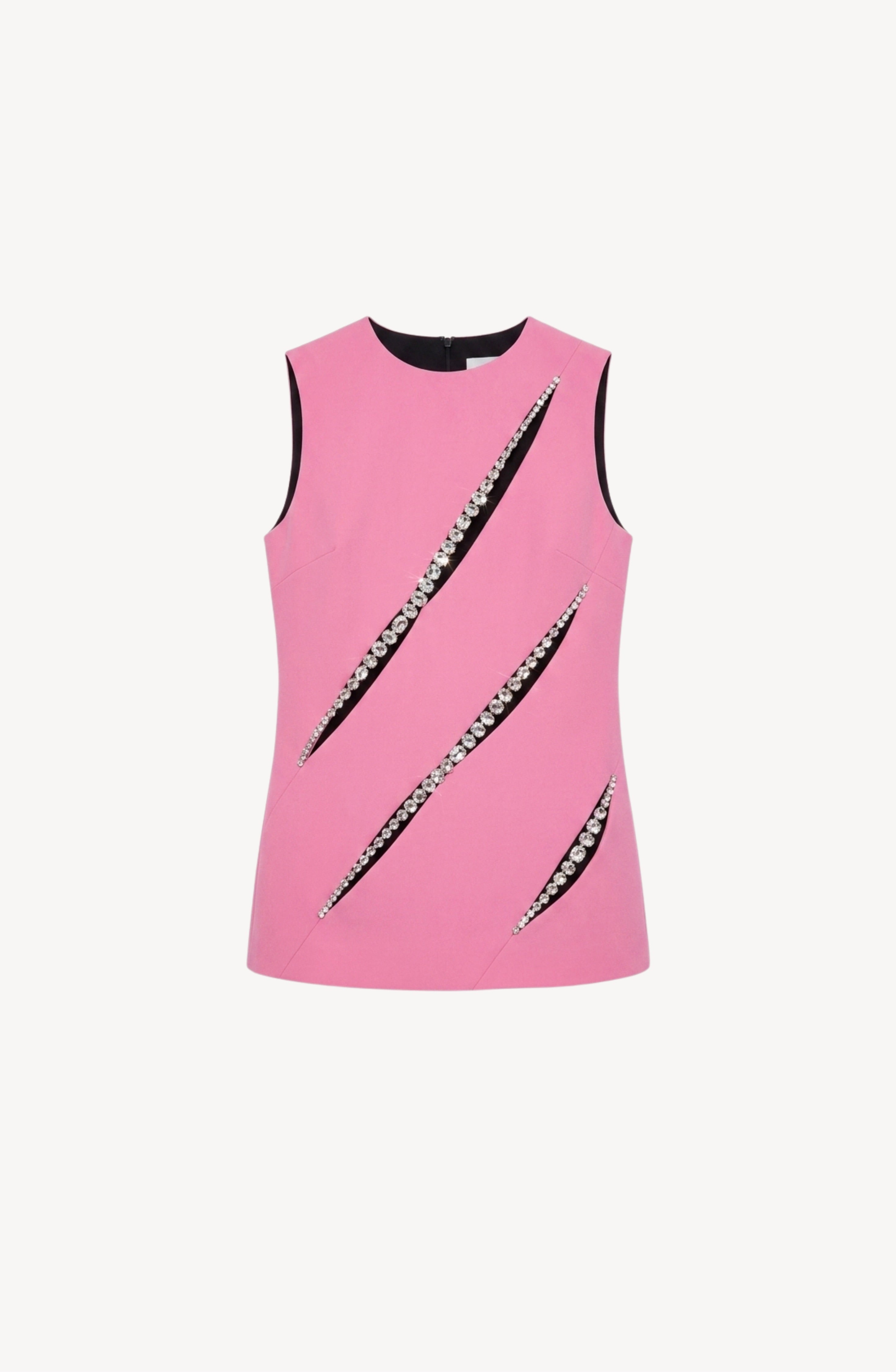 The Peony Crystal Slash Top by LOULOU is a sleeveless, pink structured crepe top designed with three diagonal front slit cutouts, each accented with sparkling silver glass crystal trim. Featuring a round neckline and black inner lining at the sleeves, it presents a bold sleeveless shift silhouette.