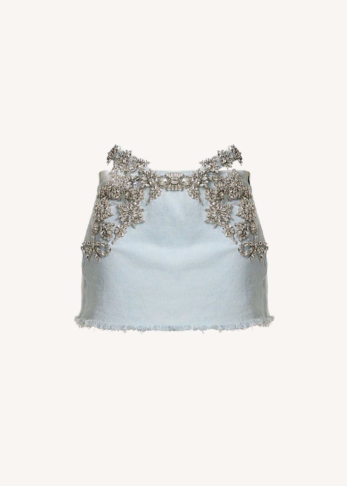 A light blue, sleeveless crop top with silver floral embroidery accents the neckline and shoulders, paired with the LOULOU Amélie Mignonne high-waisted denim mini skirt, set against a simple light background.