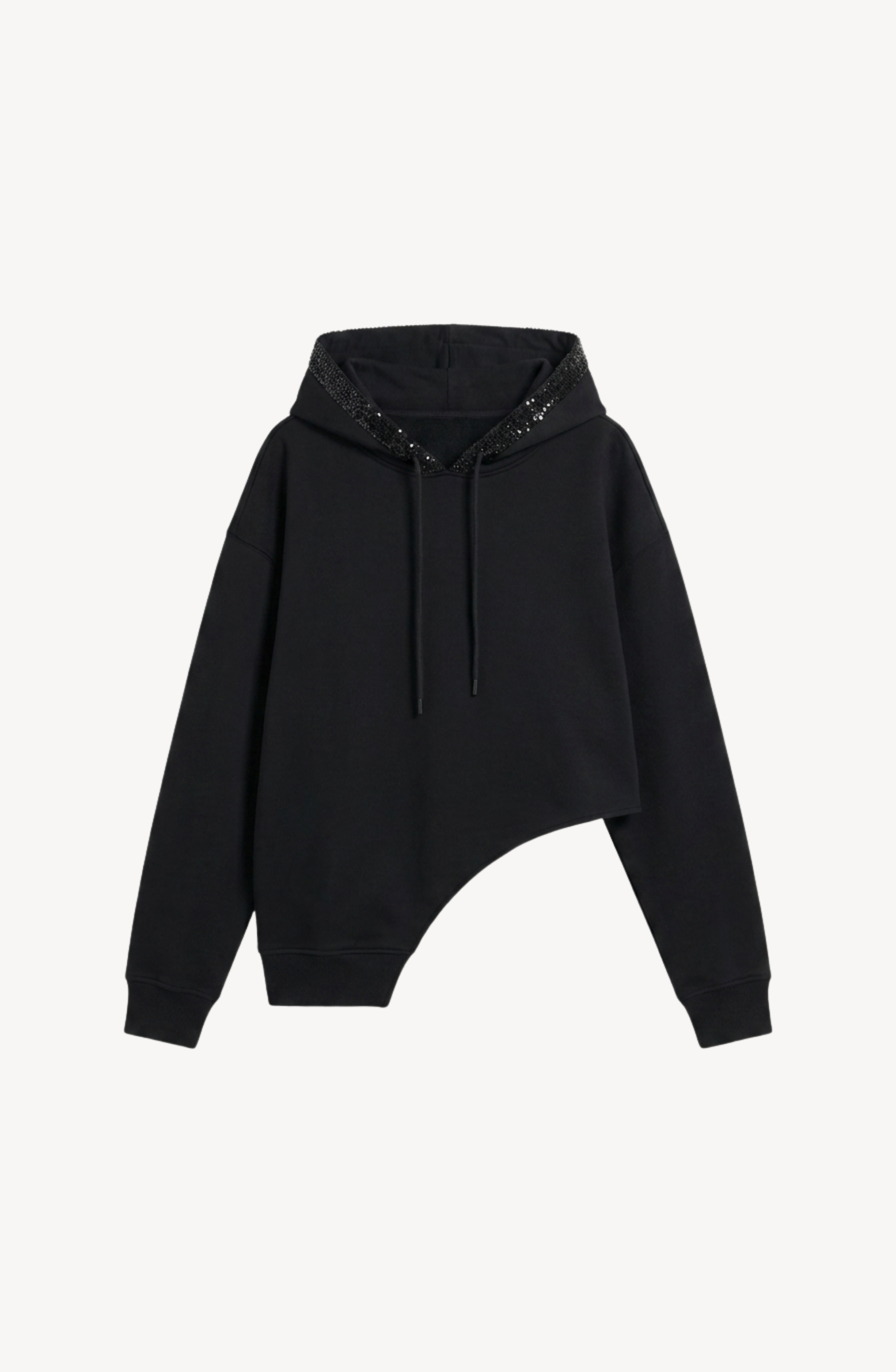 The LOULOU Crystal Trim Asymmetrical Hoodie is a black oversized piece crafted from heavyweight cotton jersey, featuring an asymmetrical hem, long sleeves with drawstrings, and a hood embellished with crystal and sequin accents.