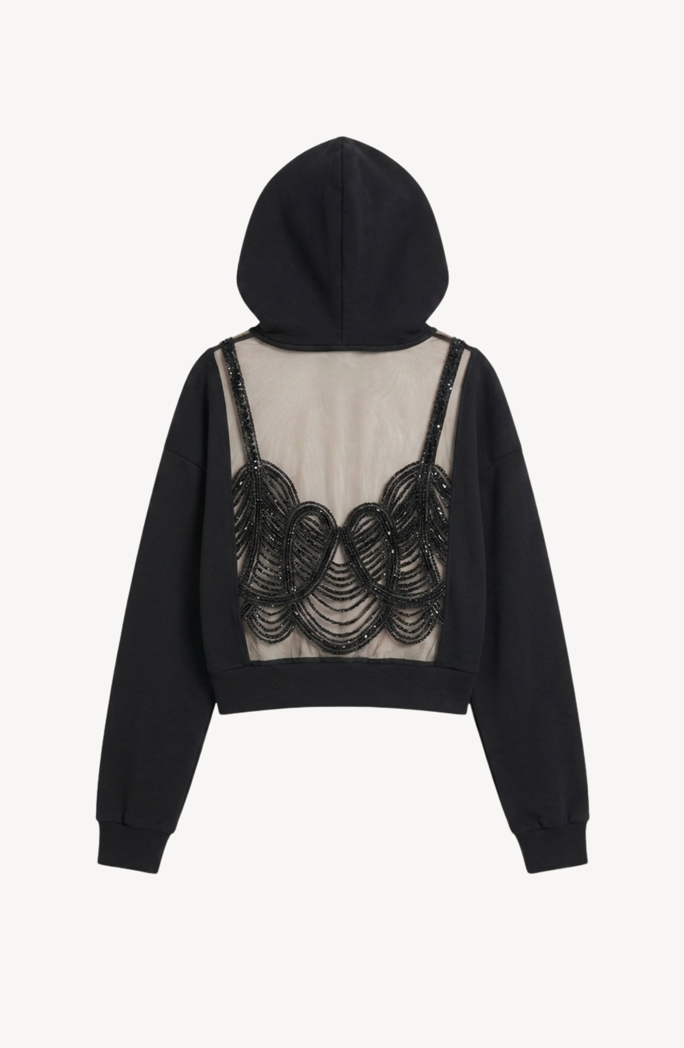 Introducing the LOULOU Embellished Tulle Back Cropped Hoodie, a black cotton hoodie uniquely designed with a sheer tulle back panel embellished with elegant black sequin embroidery in a scalloped bralette-inspired pattern.