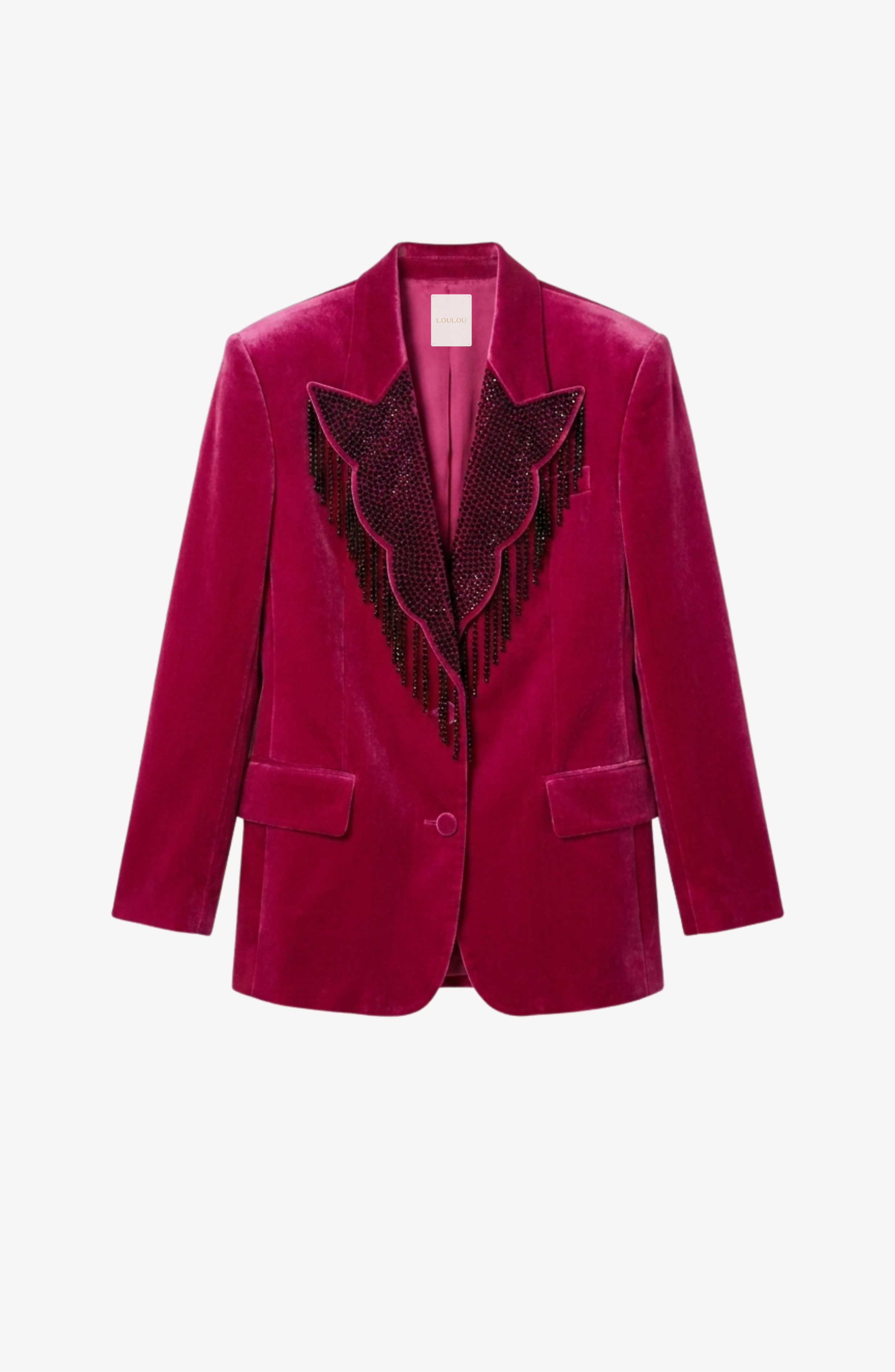 The LOULOU Fuchsia Velvet Blazer features sharp shoulders, two front pockets, and black beaded fringe along the lapels, shown on a plain white background.