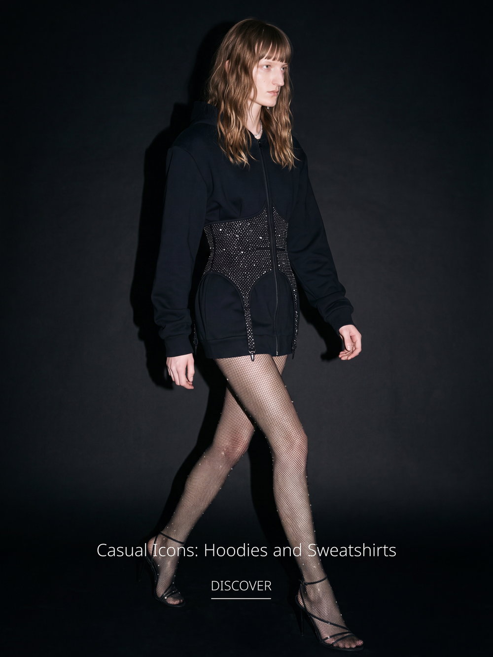 Model wearing a black embellished corset hoodie from the LOULOU Hoodies & Sweatshirts collection.